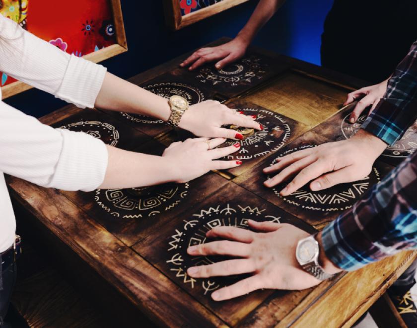 people playing a board game